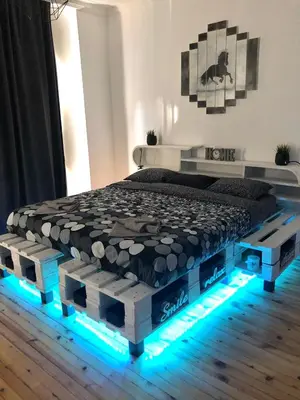 a bedroom with a bed with lights on the floor at Spacious modern vintage flat in the heart of Sofia in Sofia
