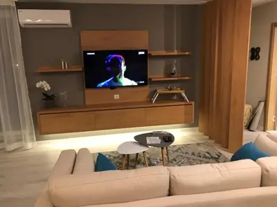 a living room with a couch and a flat screen tv at Riverside apart in Blagoevgrad