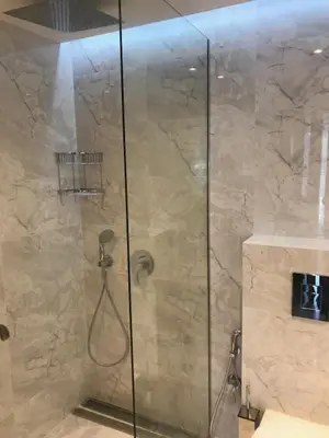 a shower with a glass door in a bathroom at Riverside apart in Blagoevgrad