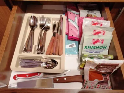 a table with a tray with utensils and utensils at Apartment Viki Pamporovo in Pamporovo