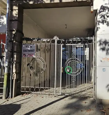 a gate with decorations on it in front of a building at Serdika station, bright and cozy apartment in Sofia