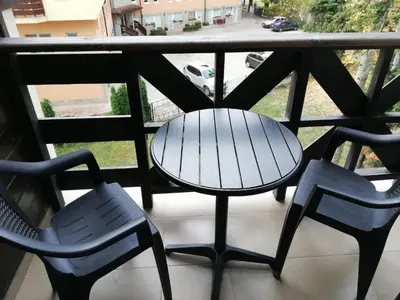 a table and chairs on a balcony with a view at Iglika 2, A6 in Borovets