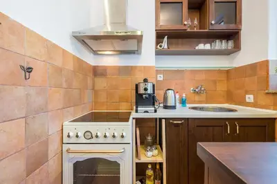 a small kitchen with a stove and a sink at FUNKY FRESH place in the heart of Sofia in Sofia