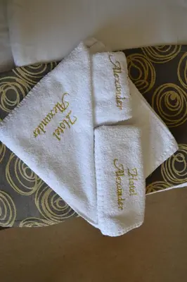 two white towels with the words christmas on them at Alexander Hotel in Asenovgrad