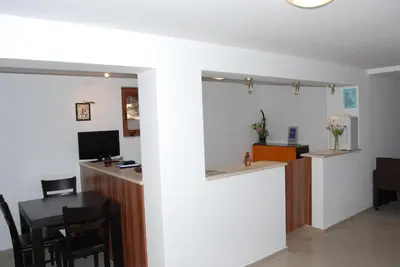 an office with a desk and a table with chairs at Vidima Apartment Hotel in Apriltsi