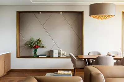 a living room with a table and a vase of flowers at Grand Hotel Millennium Sofia in Sofia