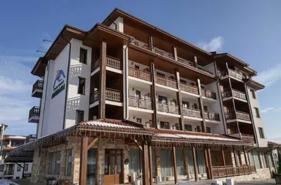 a large building with balconies on top of it at Park Hotel Panorama in Bansko