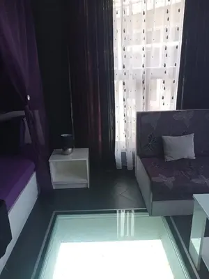 a living room with a couch and a window at Бора Бора in Sapareva Banya
