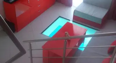 an overhead view of a bedroom with red and blue furniture at Бора Бора in Sapareva Banya