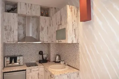 a kitchen with a sink and a microwave at IFM Boutique studio in Plovdiv