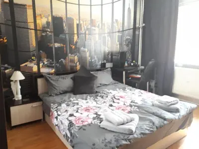 a bedroom with a bed with towels on it at New York - Room for overnight travelers near the Airport, parking in Sofia