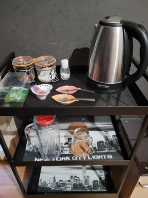 a tea pot and other items on a table at New York - Room for overnight travelers near the Airport, parking in Sofia