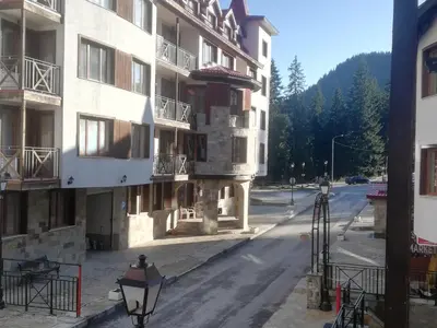 an empty street in front of a building at Апартамент 109 Комплекс 