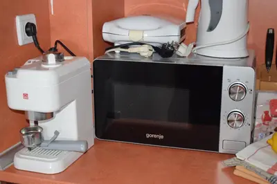 a mixer sitting next to a microwave on a counter at Ski 'Inn Monastery 3 Ski-to-Door in Pamporovo