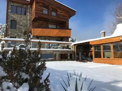 a house in the winter with snow on the ground at RELAX Guest House in Tsigov Chark