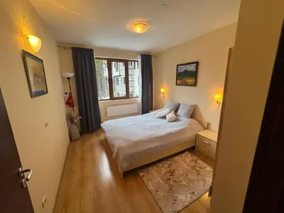 a small bedroom with a bed and a window at Pamporovo Apartment 314 The Castle 3 in Pamporovo