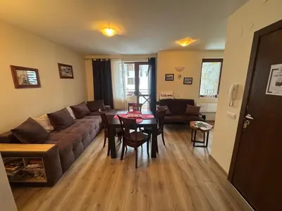 a living room with a couch and a table at Pamporovo Apartment 314 The Castle 3 in Pamporovo