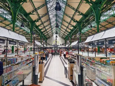 a large market with people walking through the aisle at Apartment Memoir by SofiaSpot - central, metro to airport in Sofia