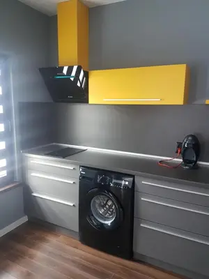 a washer and dryer in a laundry room at LUXURY SUITES in Karlovo