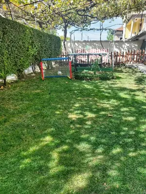 a yard with a goal in the grass at Стаи за гости Върбите in Sapareva Banya