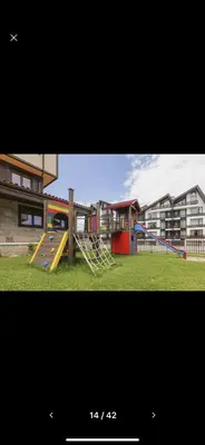 a playground with a slide at Terra Complex SPA apartment 1 bedroom suite in Razlog