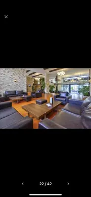 a living room with couches and tables and chairs at Terra Complex SPA apartment 1 bedroom suite in Razlog