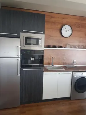 a kitchen with a microwave and a sink at LUXURY SUITE 2 in Karlovo
