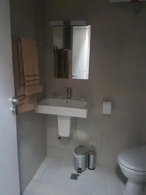 a bathroom with a sink and a toilet at LUXURY SUITE 2 in Karlovo