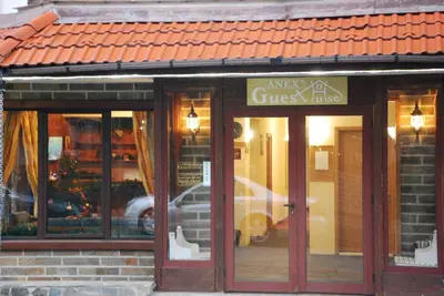 a close up of a store front with glass windows at Guest House ANEX in Bansko