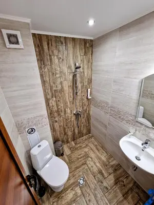 a bathroom with a toilet and a sink at Sapareva Apartments in Sapareva Banya