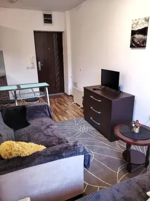 a living room with a couch and a table at Double Studio near SKI Lift - Bansko in Bansko