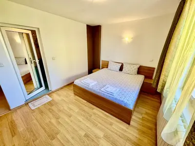 a small room with a bed and a window at TM HOUSE - Private Rooms in Bansko