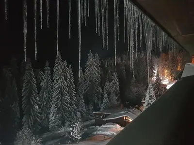 a painting of a winter forest with icicles at Апартамент Pamporovo Palace in Pamporovo