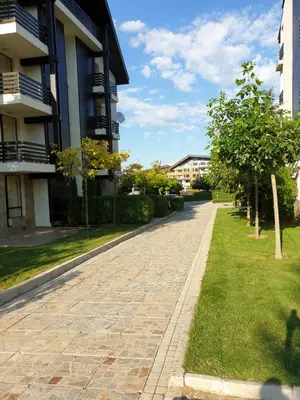 a cobblestone street in front of a building at Private Studio in Aspen Golf and Ski Resort in Razlog