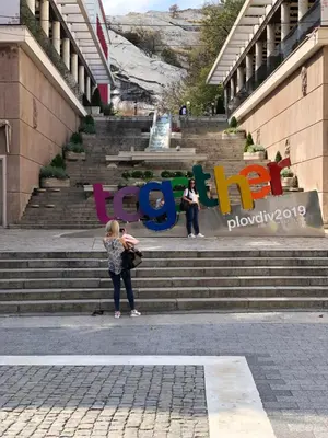 a group of people standing on the stairs of a building at Beautiful best location apartment Green Mouse in Plovdiv
