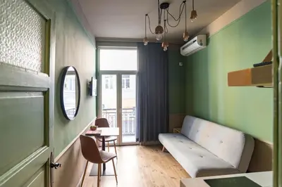 a living room with a couch and a table at Beautiful best location apartment Green Mouse in Plovdiv