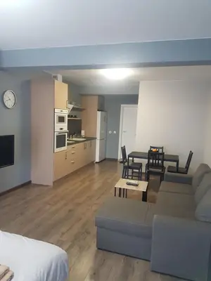 a living room with a couch and a table at LUXURY SUITES 3 in Karlovo