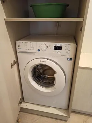 a washer and dryer in a utility room at Emerald Buddha Apartment in Bansko
