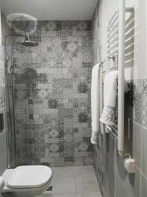 a bathroom with a shower and a toilet in it at Apartment Unique in Plovdiv