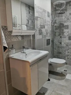 a bathroom with a sink and a toilet at Apartment Unique in Plovdiv
