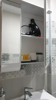 a kitchen with a sink and a cabinet with a counter top at Apartment Unique in Plovdiv