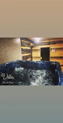 a tub filled with water in a room at Villa Ivan & Petar in Semkovo