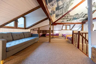 a living room with couches and a painting on the wall at Central House for up to 16 Guests Entire Place in Sofia