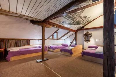 a room with three beds in a attic at Central House for up to 16 Guests Entire Place in Sofia