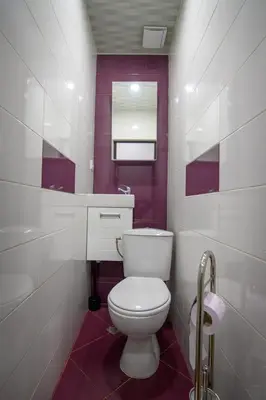 a bathroom with a white toilet and a sink at Апартамент за гости Римски терми in Kyustendil