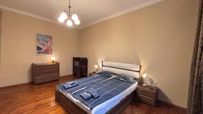 a bedroom with a bed and two night stands at 66 in Sofia in Sofia
