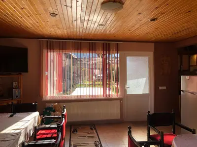 a room with a window and a table and chairs at Vasilevi House in Devin