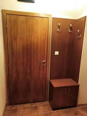 a bathroom with a wooden door and a wooden box at Studio at Home Pamporovo in Pamporovo