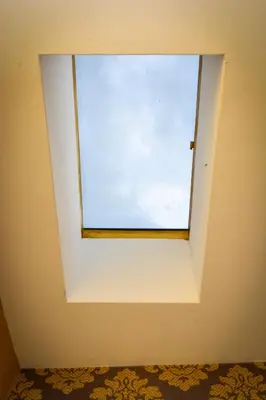 a window in a room with a white wall at Guest house VRAZHDEBNA in Sofia