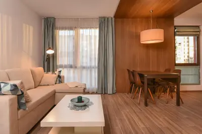 a living room with a couch and a table at The Grunge Spot - Charming NEW 1-Bedroom by Flat Mаnager in Sofia
